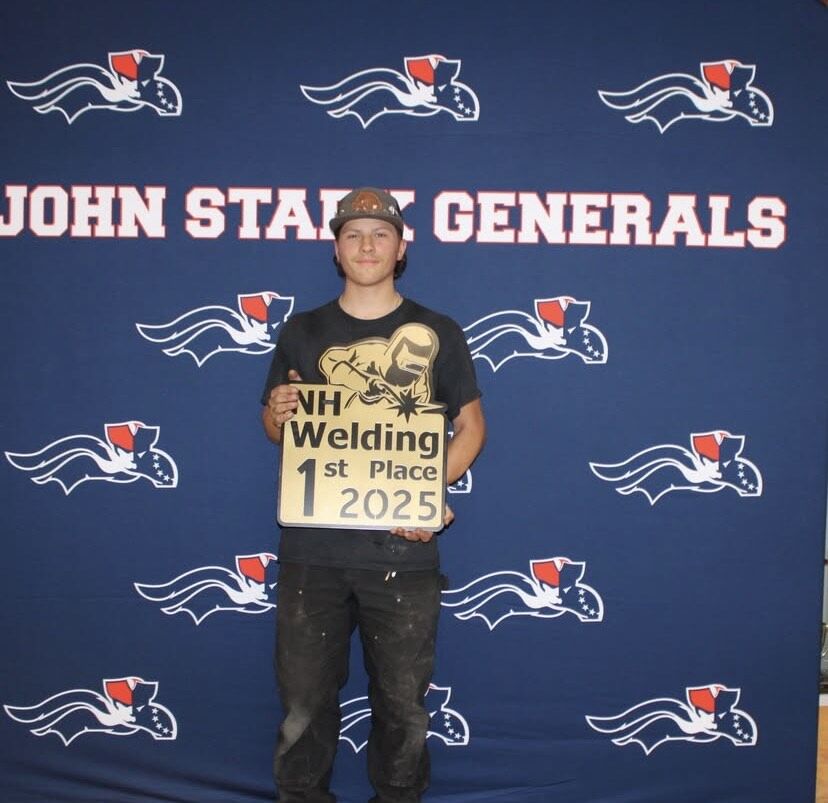 Braydon Laflamme holding the NH Welding 1st Place 2025 award