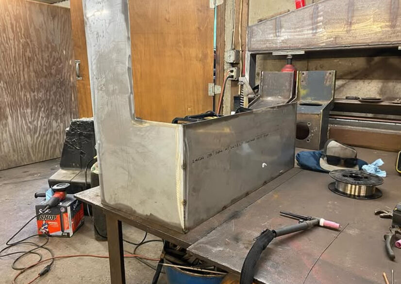 Fabricated steel water tank for a roller
